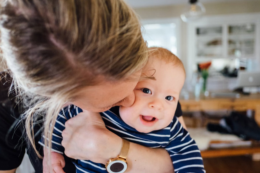 Young mother holding baby